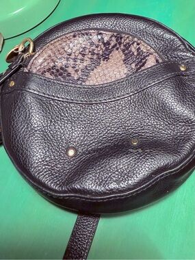See By Chloe Rosy Black Leather Round Crossbody with Snakeskin coin purse.